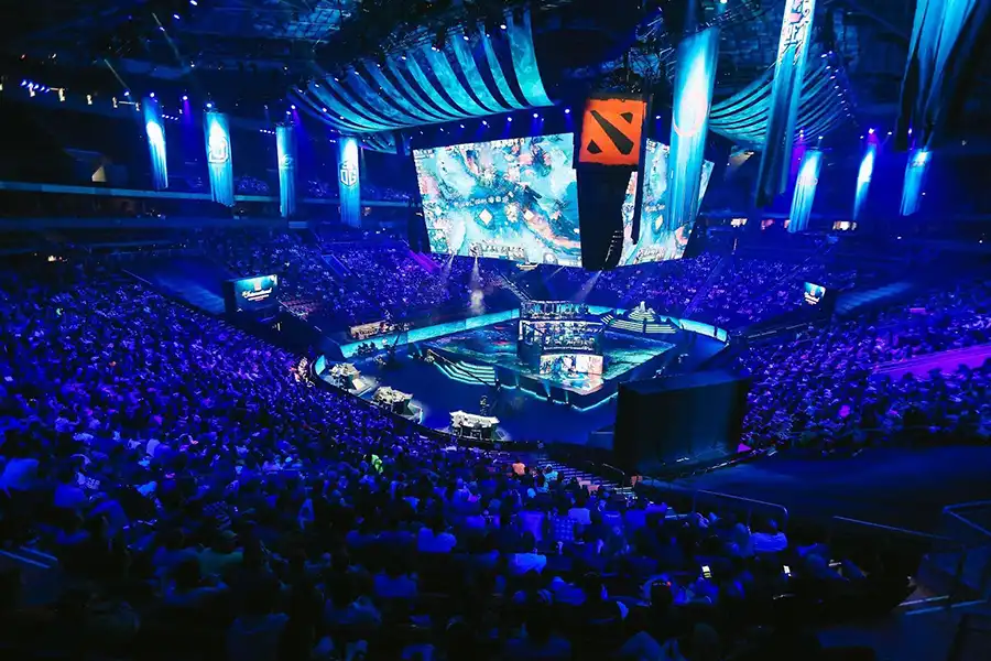 Image of Dota 2 tournament as both teams are engaged in high-intensity combat.