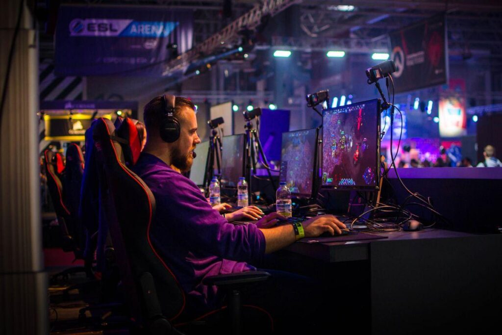 picture of a player sitting behind his gaming computer.