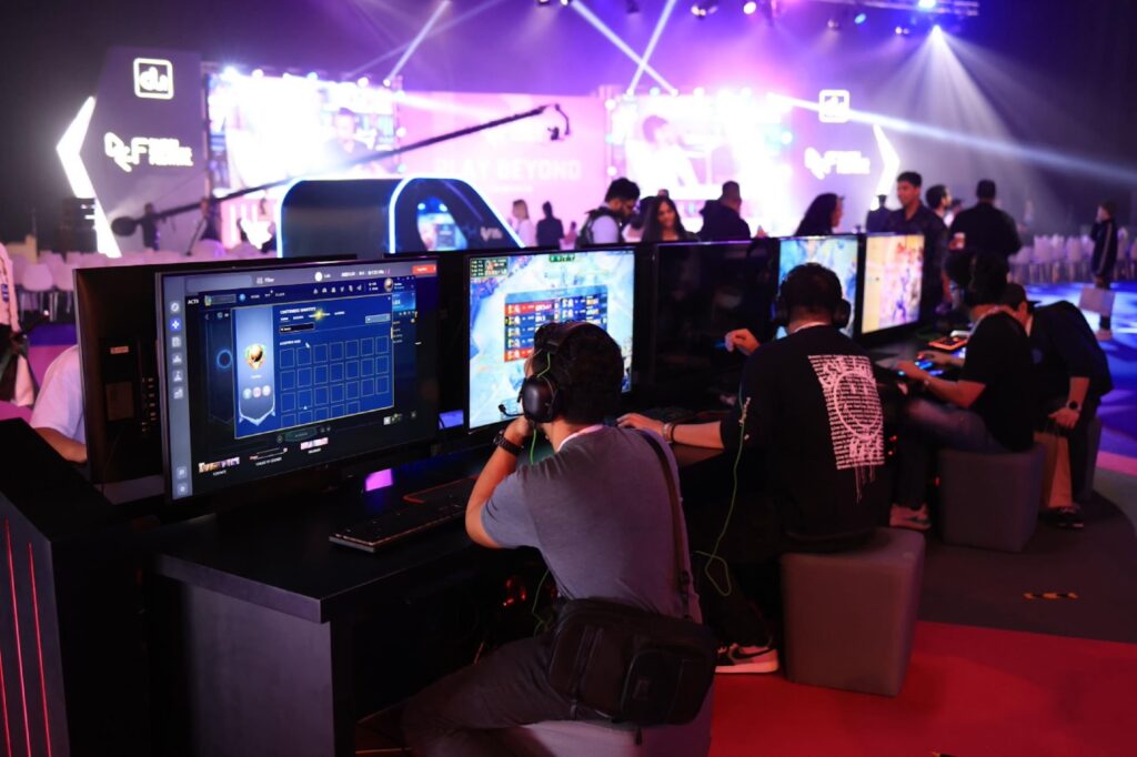 a group of players behind their gaming computers.