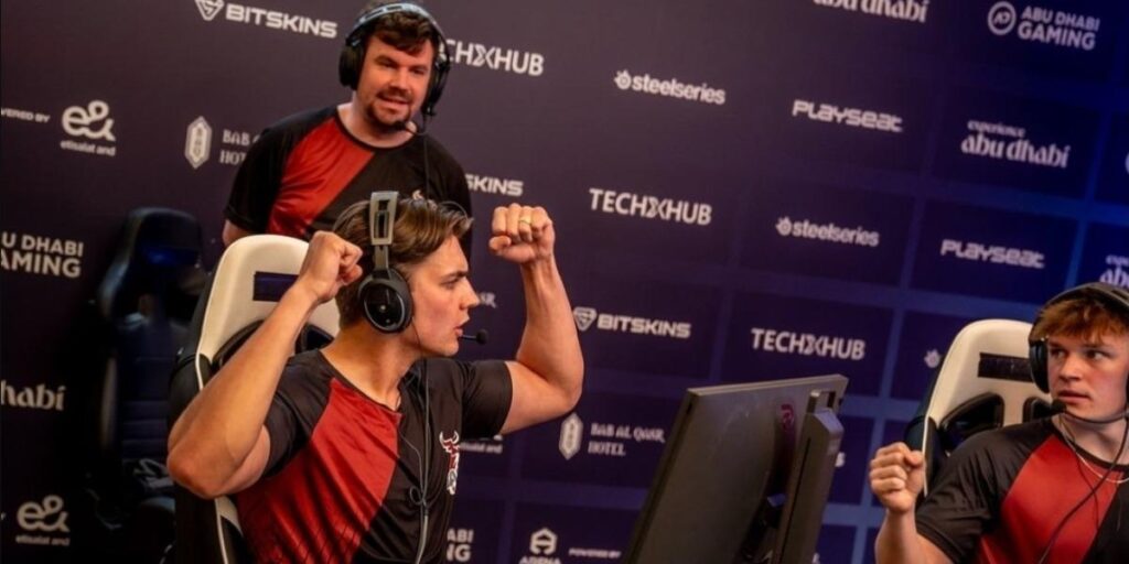 an Esports Team posing in victory.