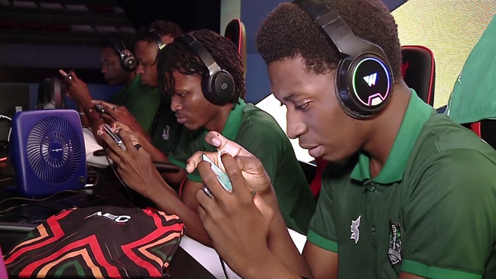 a picture of two gamers playing with their smartphones