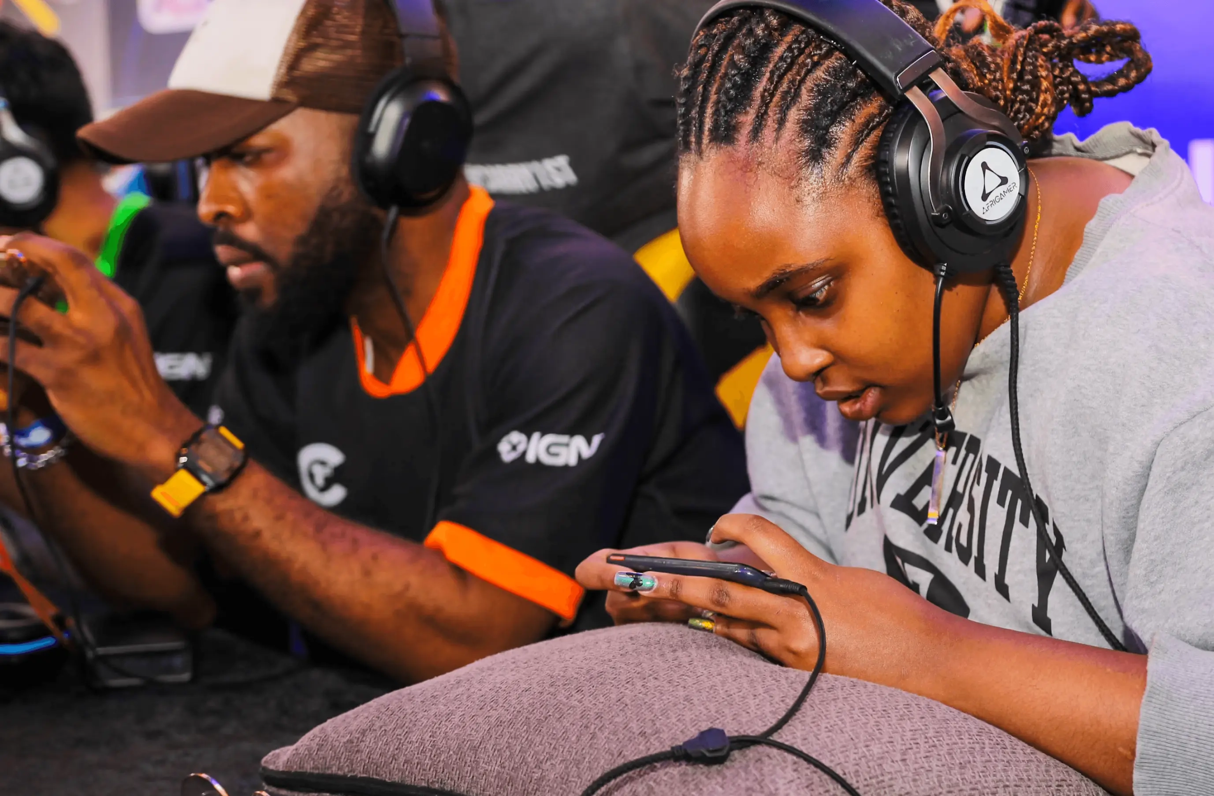an image of players playing with their smartphones.