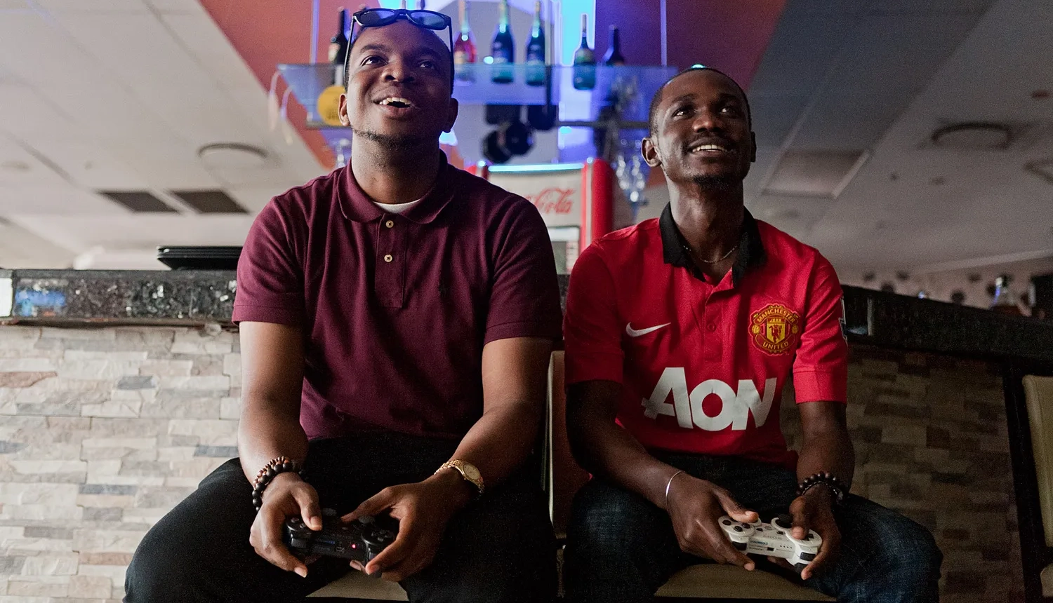 an image of two people playing video games.
