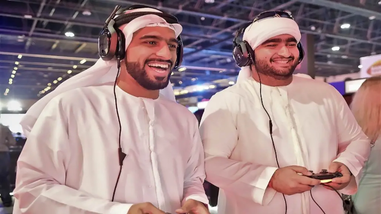 an image of two Arabian gamers playing video games.