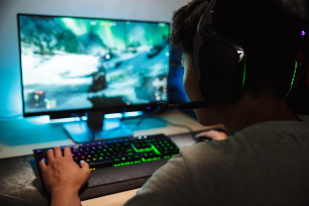 picture of a pro gamer engaged with his pc