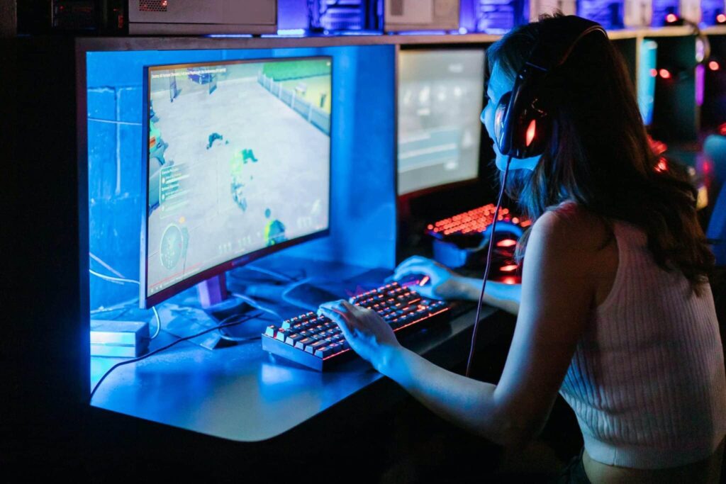 picture of a gamer sitting behind her gaming computer