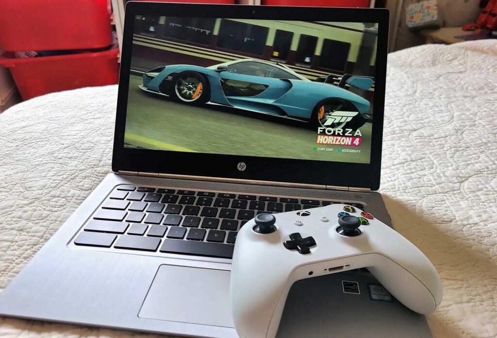 an image of an HP Laptop with an Xbox Controller on it