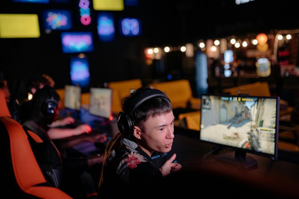 Picture of a gamer talking while playing video games