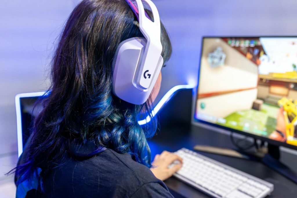 Picture of a woman playing video games on her computer