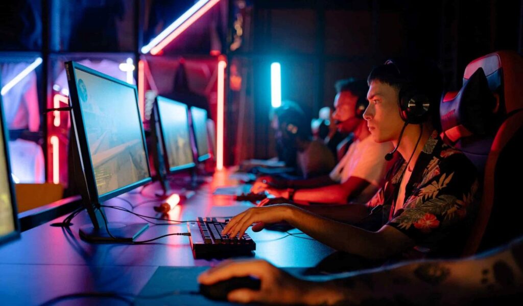 an image of a group of players playing behind their computers
