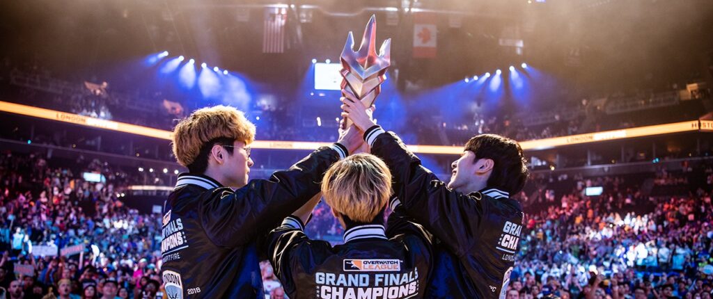 an image of an ESports team holding a trophy