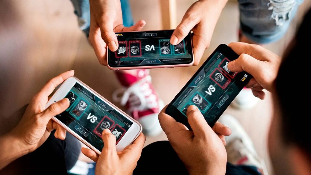 an image of a group of players while playing an online game with their smartphones