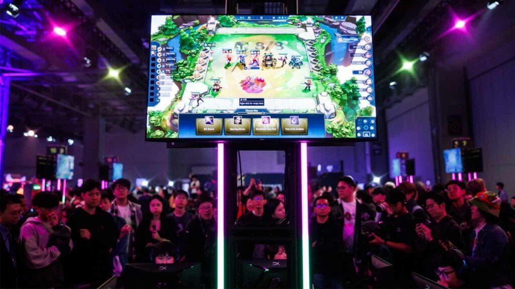 an image of a group of people looking at a monitor