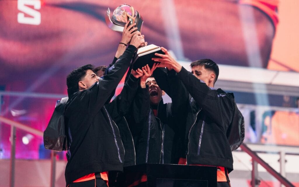 a picture of an Esports Team with PUBG Mobile World Cup Trophy